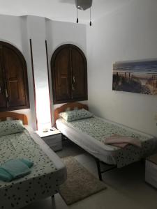 トレビエハにあるEl paraisoのベッドルーム1室(ベッド2台付)が備わります。