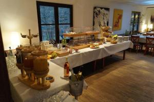 a long table with food and drinks on it at seehaus forelle haeckenhaus in Ramsen +19 photos