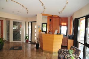 an office with a reception desk in a room at Hotel Cafe Leda in Haigerloch