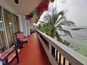 a balcony of a resort with a view of the ocean at La Veranda Di Serena in Unawatuna