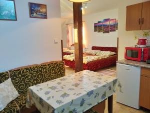 A bed or beds in a room at András penzión