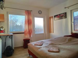 A bed or beds in a room at András penzión