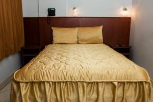 Postel nebo postele na pokoji v ubytování Hostal Vasco