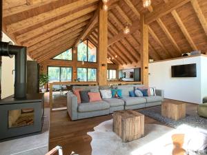 a living room with a couch and a fireplace at Chalet See Tirol - Ischgl/Kappl in See