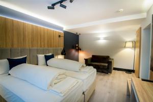 Postel nebo postele na pokoji v ubytování Hotel Wilder Mann