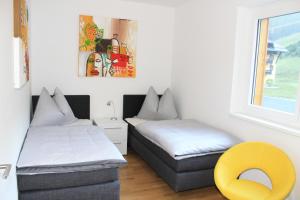 Postel nebo postele na pokoji v ubytování Ferienapartment Nassfeld