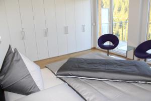 Postel nebo postele na pokoji v ubytování Ferienapartment Nassfeld