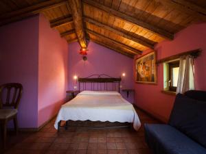 A bed or beds in a room at Agriturismo Al Marnich