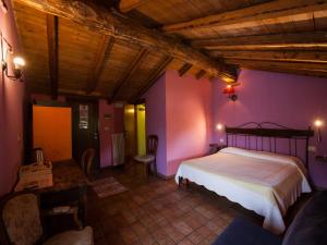 A bed or beds in a room at Agriturismo Al Marnich