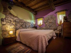 A bed or beds in a room at Agriturismo Al Marnich