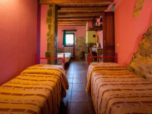 A bed or beds in a room at Agriturismo Al Marnich