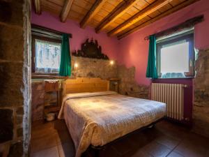 A bed or beds in a room at Agriturismo Al Marnich