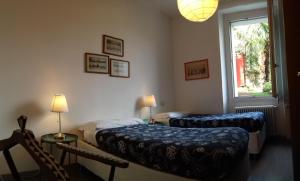 Postel nebo postele na pokoji v ubytování B&B Casa Cantoniera