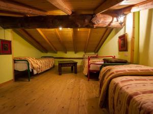 A bed or beds in a room at Agriturismo Al Marnich