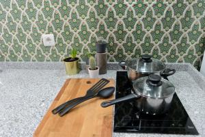 Kuchyň nebo kuchyňský kout v ubytování Apartamentos Puerta Real Sevilla