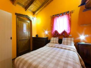 A bed or beds in a room at Agriturismo Al Marnich