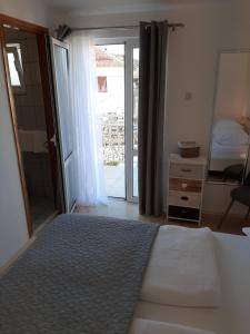 Postel nebo postele na pokoji v ubytování Sunshine Apartment Sovlje