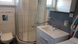 Kúpeľňa v ubytovaní Apartmani Zorzo