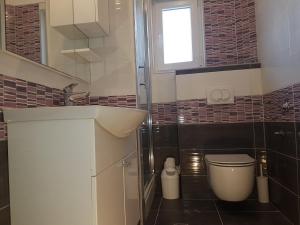 Kúpeľňa v ubytovaní Apartmani Zorzo