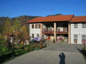 a shadow of a person standing in front of a house at Ciabot Besimauda in Peveragno