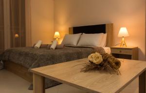 מיטה או מיטות בחדר ב-Central Luxury Studio