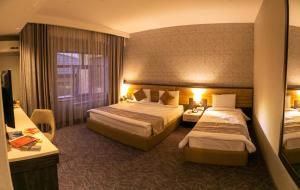 Postel nebo postele na pokoji v ubytování Parkway Inn Hotel & Spa
