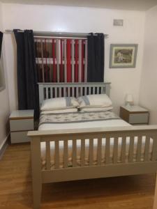 a bedroom with a bed with a headboard at Fairhaven Hotel on Woodfield Road in Blackpool