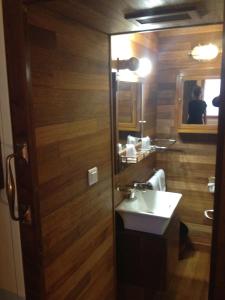 a bathroom with a sink and a mirror at Hôtel Kermor in Concarneau