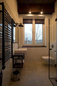 Koupelna v ubytování Apartamenty Folwark Boguszyn + 37 fotografií