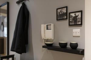 a bathroom with two bowls on a shelf at Centrally located apartment in Duke Street- free parking- two bathrooms in Liverpool