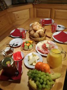 a table topped with lots of different types of food at Biohof Sattler in Etmissl