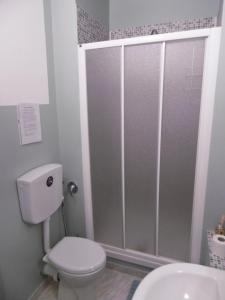 a bathroom with a shower with a toilet and a sink at Affittacamere Girasole in Foligno +14 photos