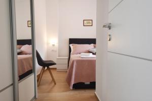 A bed or beds in a room at Karlo apartments