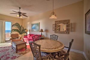 a living room with a table and chairs and a couch at Gulf Coast Luxury Getaway on Orange Beach with Views in Orange Beach