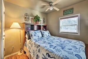 a bedroom with a bed and a ceiling fan at Tropical Island Escape with Deck, Walk to Avalon Bay in Avalon