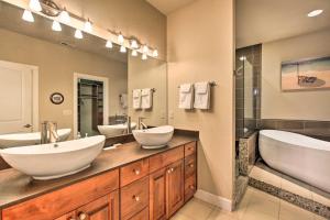 a bathroom with two sinks and a large mirror at The Ark at Farewell Park, 20 Mi to Mt Bachelor! in Bend +22 photos