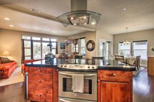 a kitchen with a stove top oven in a room at The Ark at Farewell Park, 20 Mi to Mt Bachelor! in Bend