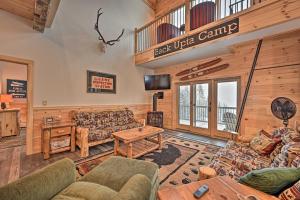 a living room with couches and a table at Rustic 3-Story Pittsburg Cabin with Lake and Mtn Views in Pittsburg