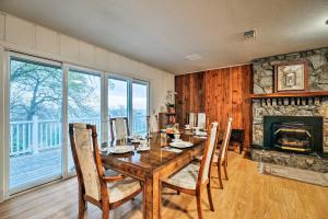 a dining room with a table and a fireplace at Unique Yosemite Mountaintop Retreat on 100 Acres in Mariposa