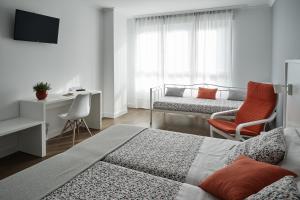 Łóżko lub łóżka w pokoju w obiekcie Xabarin Rooms