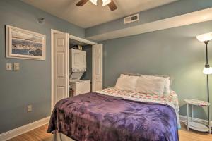 een slaapkamer met een bed met een paarse deken bij Ocean City Escape Less Than 1 Mile to Beaches and Boardwalk! in Ocean City