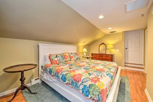 a bedroom with a bed and a table at Oceanside Beach House in Pvt Beach Community! in Mantoloking