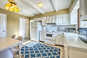 a kitchen with white appliances and a blue rug at Oceanside Beach House in Pvt Beach Community! in Mantoloking
