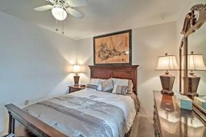a bedroom with a bed and two tables with lamps at Updated Apartment Walking Distance to Venice Beach in Venice