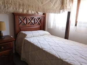 En eller flere senge i et værelse på Apartamentos al-Andalus