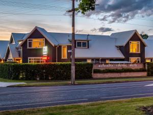 a house on the side of a street at Matamata Central Motel in Matamata