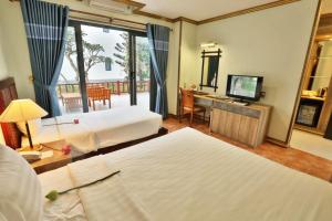 Una cama o camas en una habitación de Lotus Vung Tau Resort & Spa