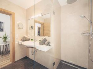 a bathroom with a sink and a shower at Apart Garni Montana in Pertisau +129 photos