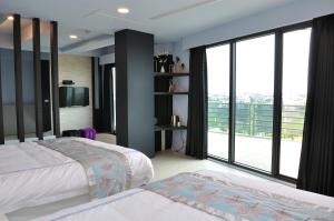 Posteľ alebo postele v izbe v ubytovaní Qian Qian Riverside B&B