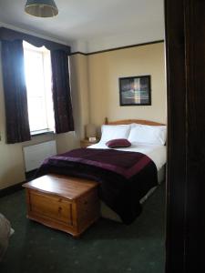 Letto o letti in una camera di Buggle's Pub and Accommodation